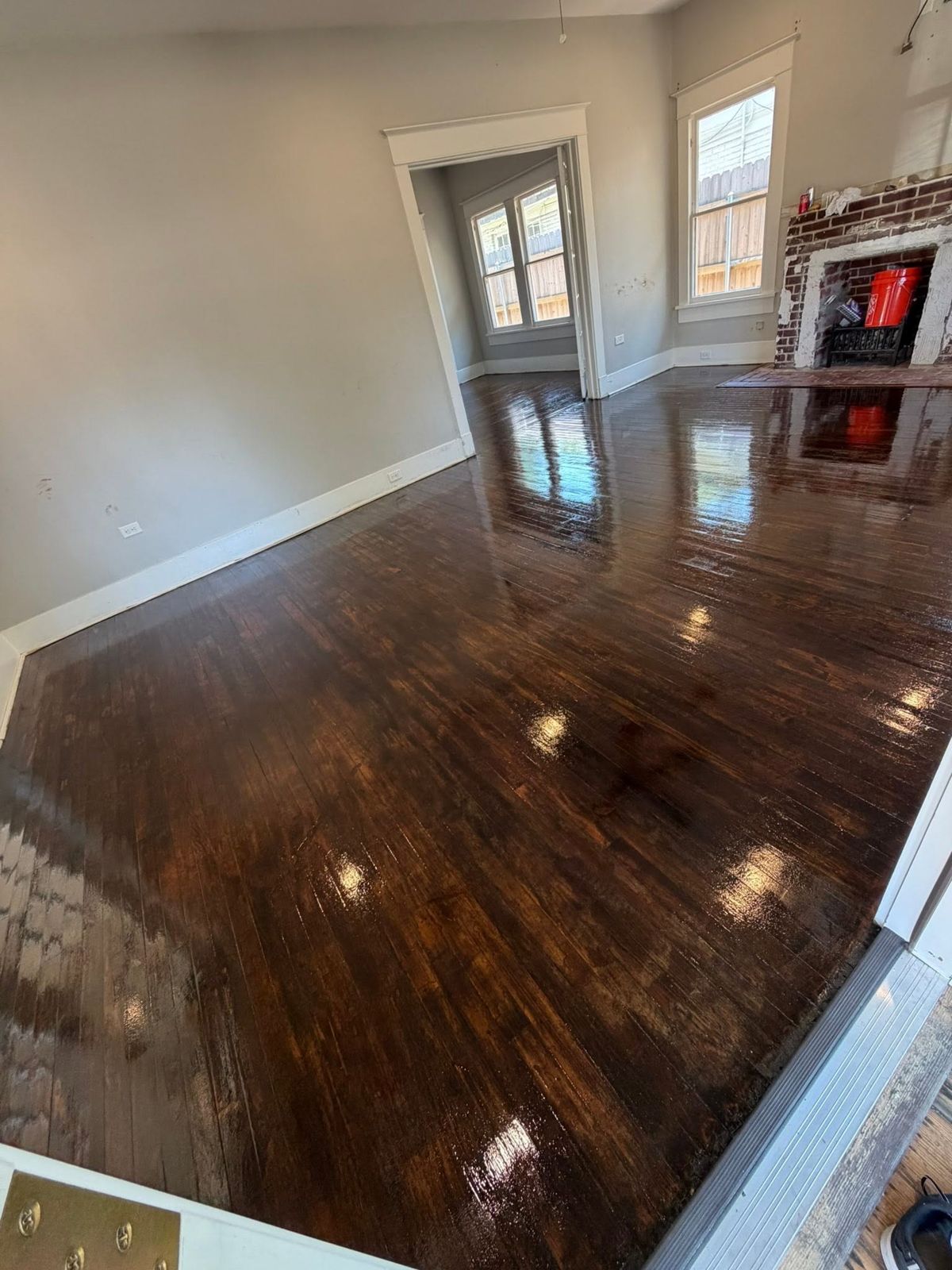 Living room with freshly refinished dark hardwood floors