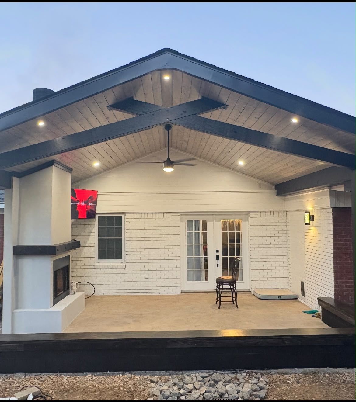 Covered patio with outdoor fireplace