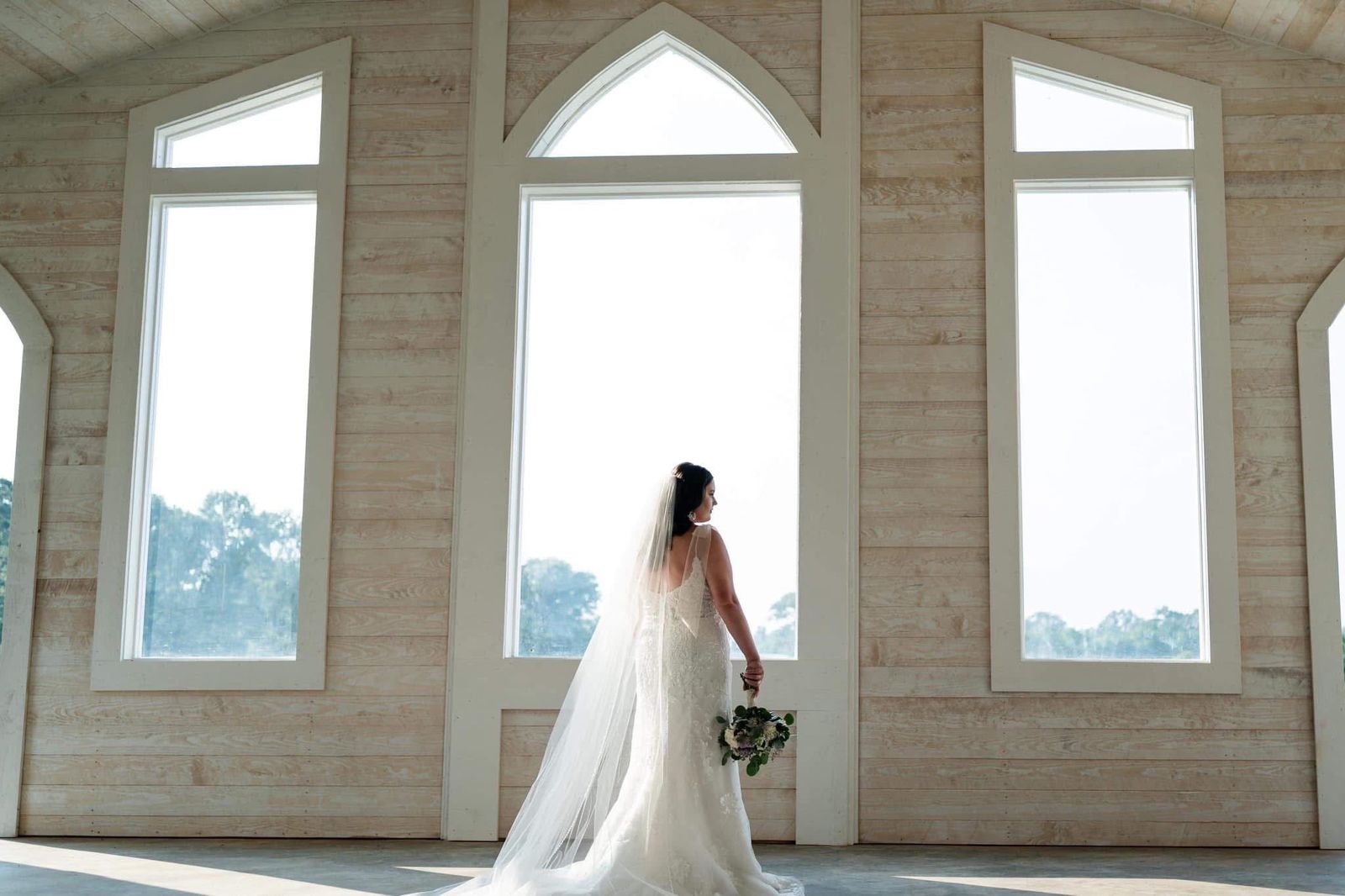 Bride in the chapel windows