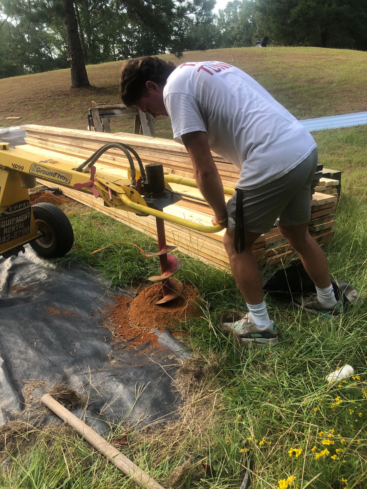 Augering post holes